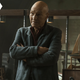 Jean-Luc Picard crosses his arms in surprise.